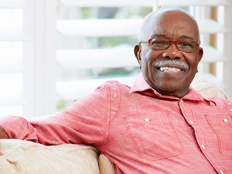 Older man sitting on couch